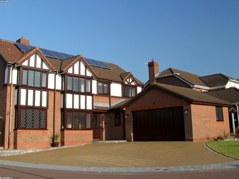 A completed home with a new driveway by JT Construction
